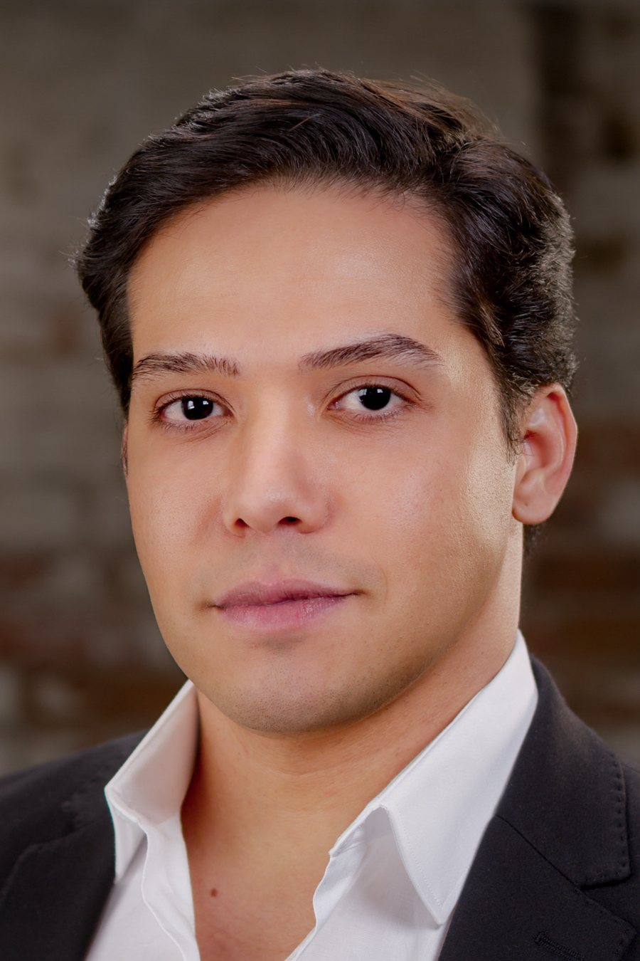 Bruno DiSanto, headshot in white shirt and blazer